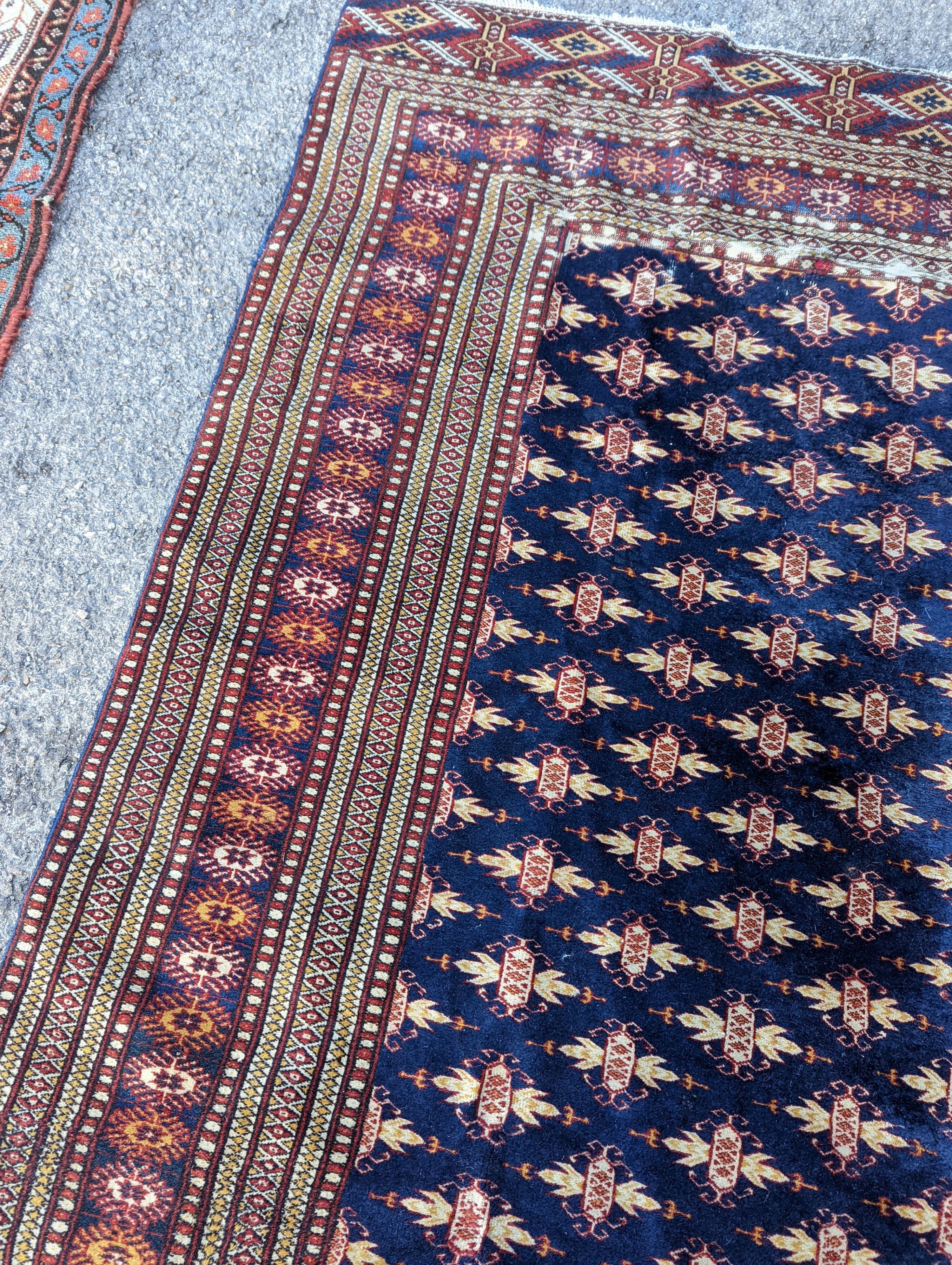 A Bokhara blue ground rug, 191 x 126cm